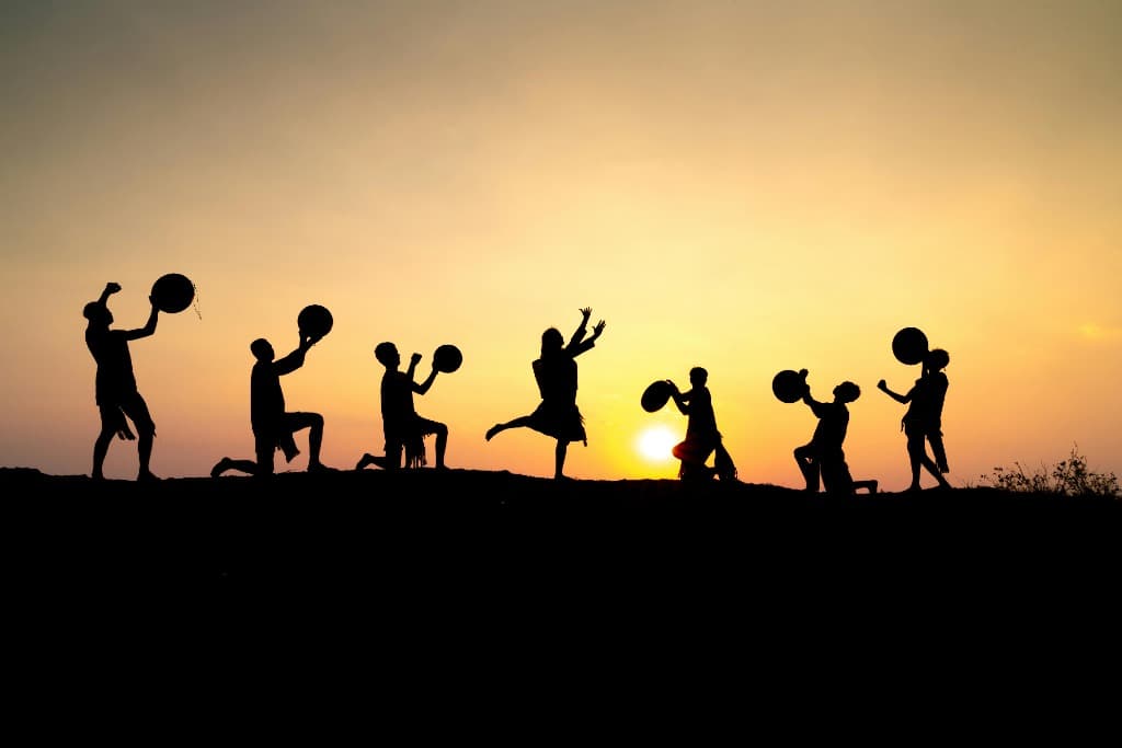 Children playing at sunset in rural India